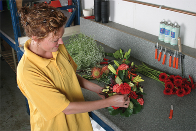 Dianthus florist making a flower arrangement