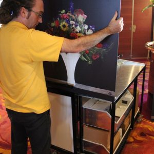 Florist holding a flower painting